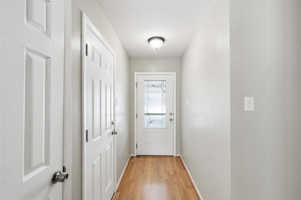 425 Ridgecrest Drive Saginaw, TX 76179 - Photo 6 of 27 a view of a hallway with wooden floor