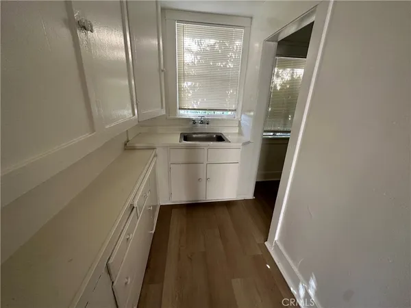 a bathroom with a sink a mirror and a shower