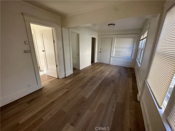 a view of hallway with wooden floor