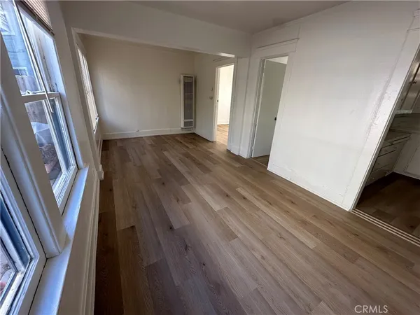 a view of wooden floor in an empty room