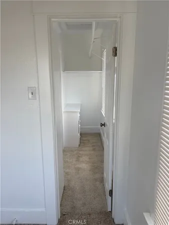 a bathroom view of a toilet and a shower