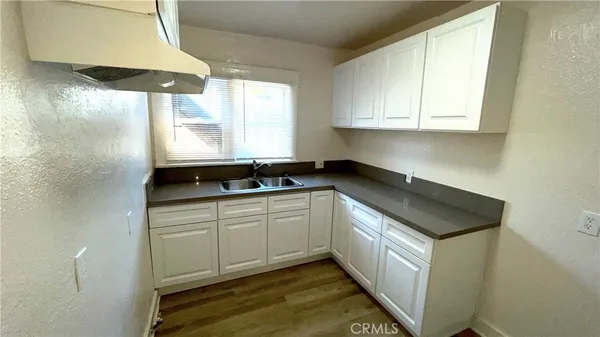 a kitchen with a sink and a window
