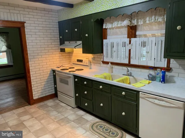 a bathroom with a sink vanity granite and a mirror