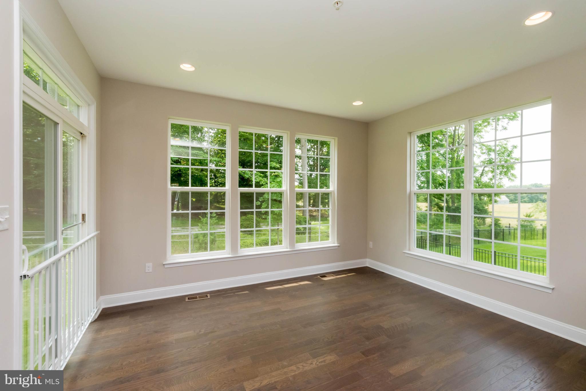 4229 Perry Hall Road Perry Hall, MD 21128 - Photo 11 of 30 a view of an empty room with a window and kitchen view