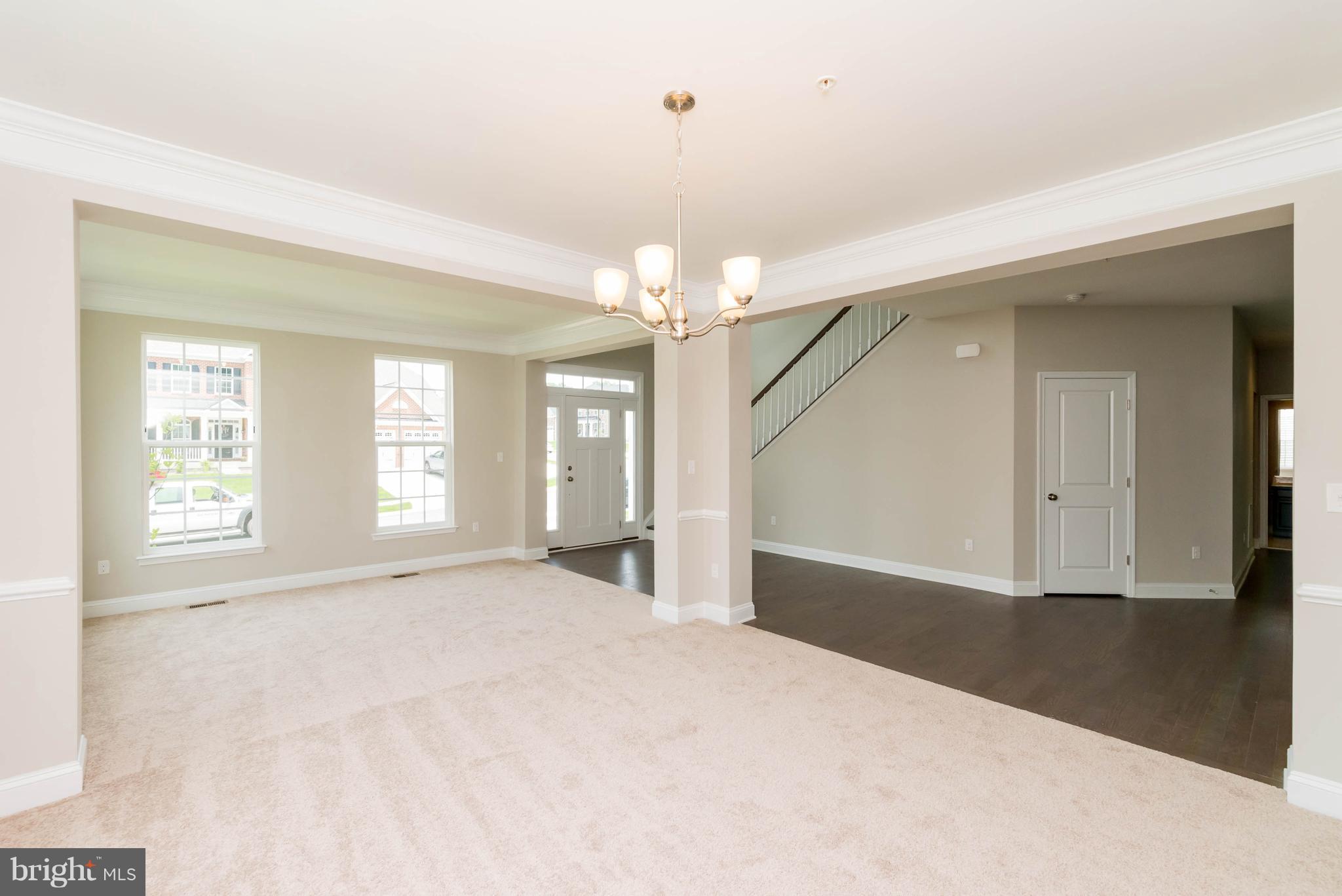 4229 Perry Hall Road Perry Hall, MD 21128 - Photo 5 of 30 a view of a big room with windows and chandelier