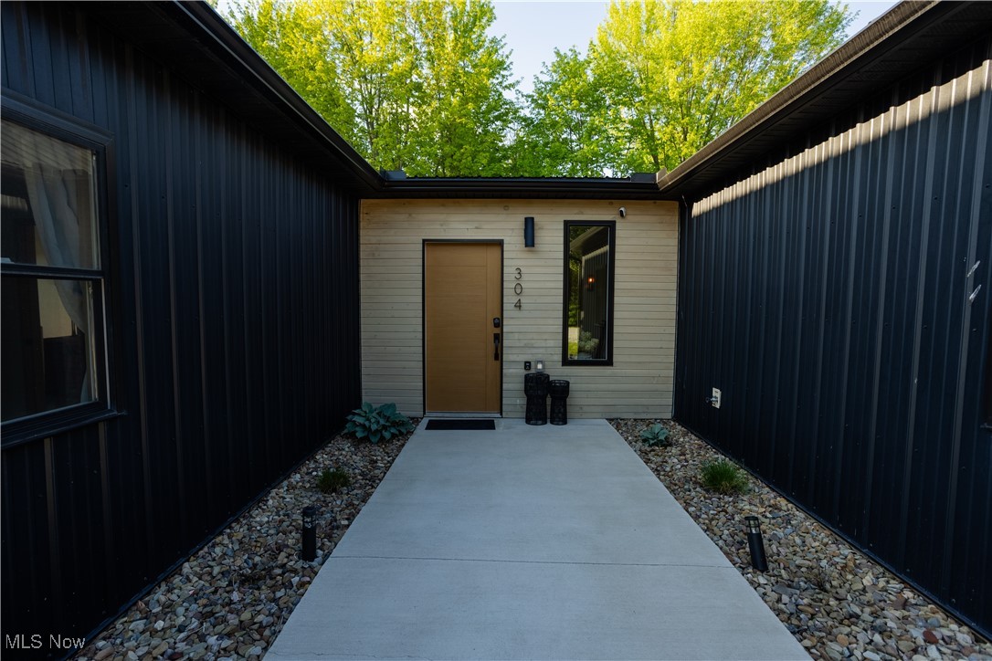 304 State Road Geneva, OH 44041 - Photo 24 of 35 Entrance to property featuring a patio area