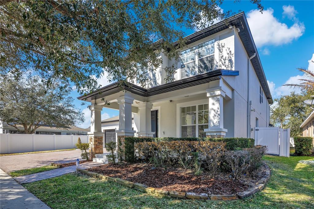 13263 Strode Lane Windermere, FL 34786 - Photo 3 of 53 a front view of a house with garden