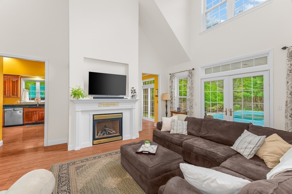 113 Greenwich Plains Road Ware, MA 01082 - Photo 10 of 42 a living room with furniture a fireplace and a flat screen tv