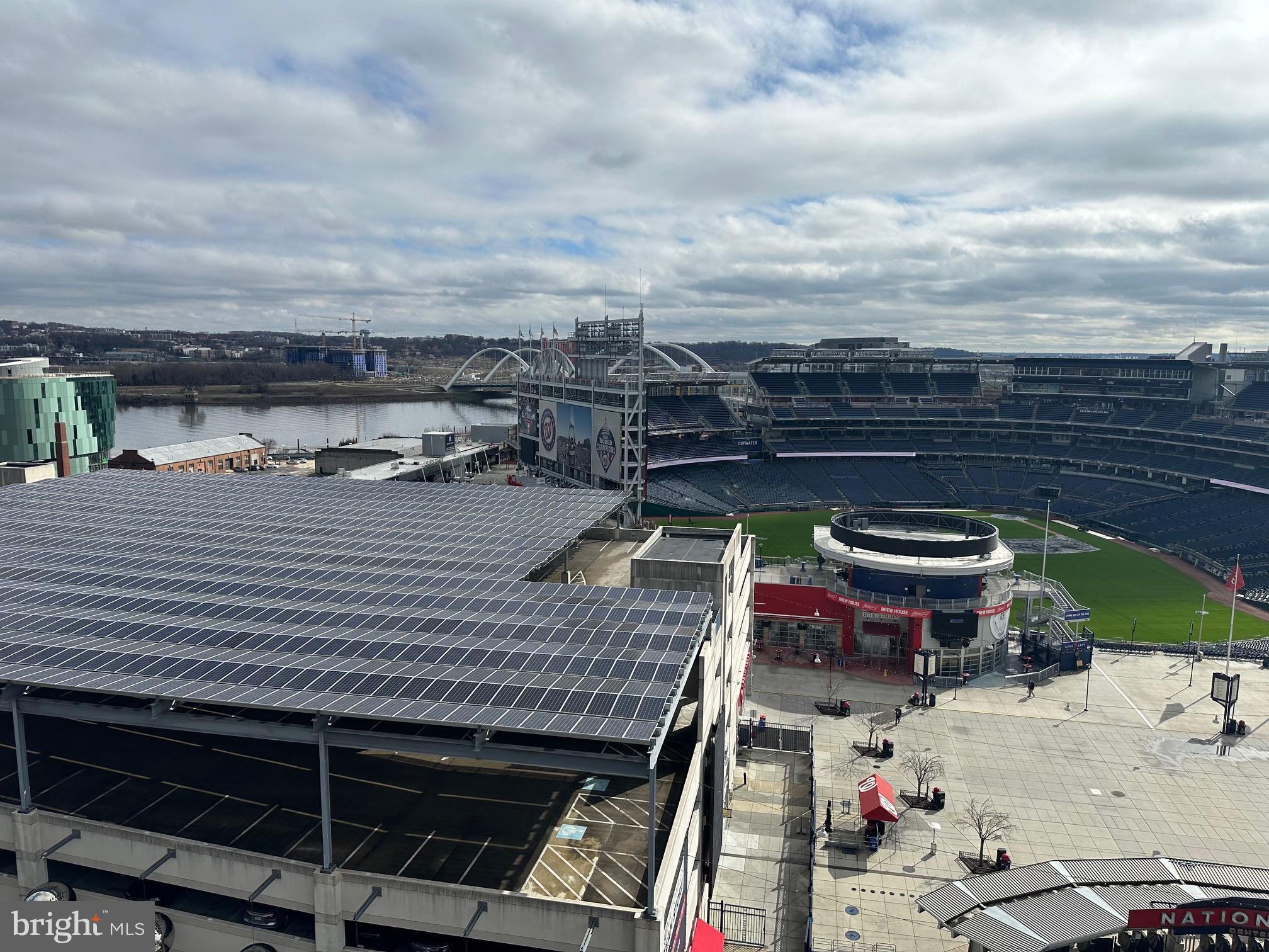 70 N Street Southeast, Unit N216 Washington, DC 20003 - Photo 19 of 20 a roof deck with a table and chairs