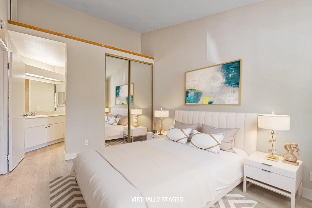 331 Shadow Run Drive San Jose, CA 95110 - Photo 11 of 25 a bedroom with a bed and a painting on the wall