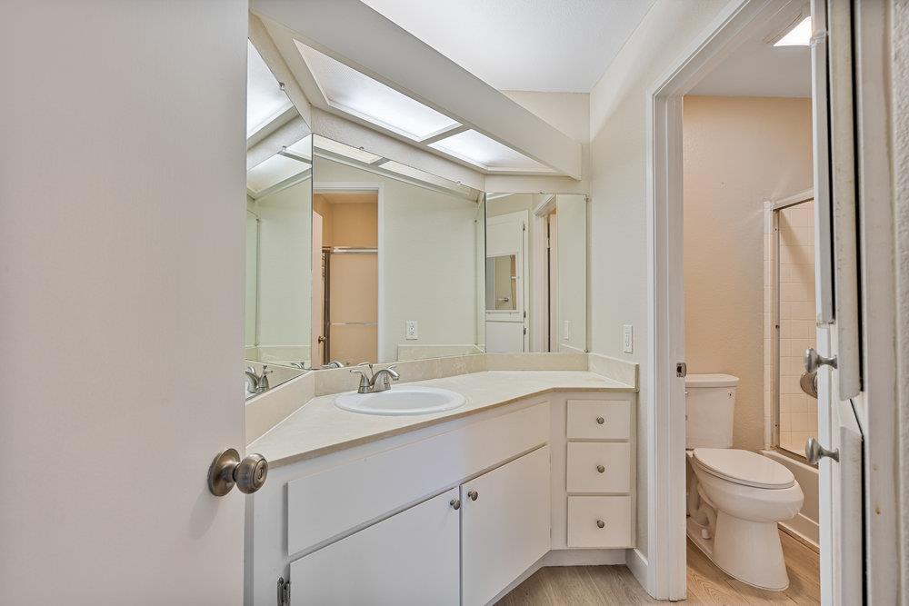 331 Shadow Run Drive San Jose, CA 95110 - Photo 14 of 25 a bathroom with a toilet sink and mirror