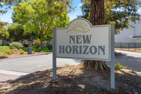 a sign board on the side of a road