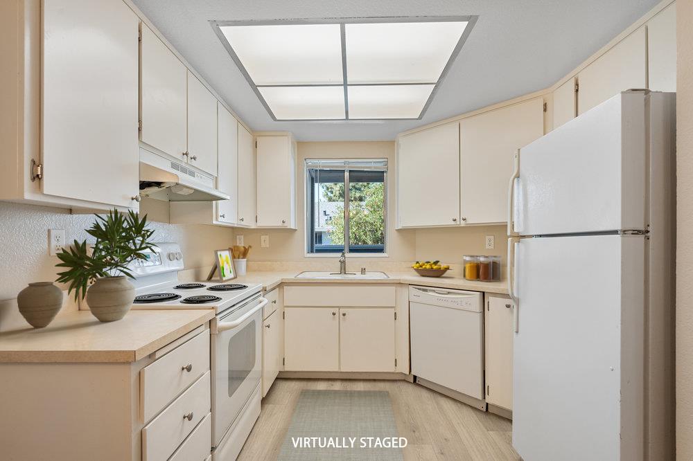 331 Shadow Run Drive San Jose, CA 95110 - Photo 6 of 25 a kitchen with a sink a refrigerator and window