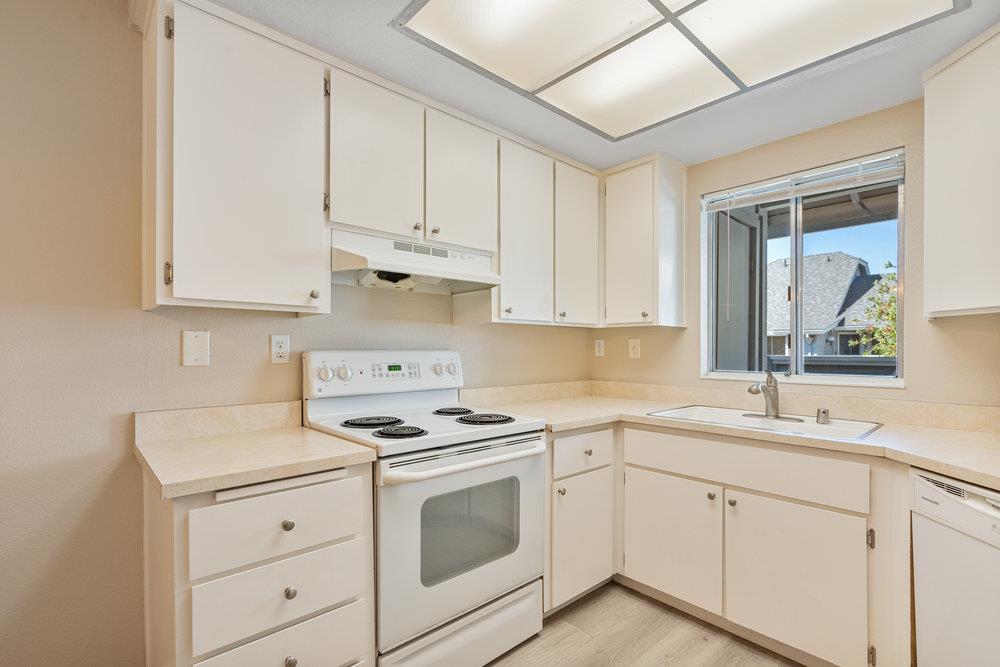 331 Shadow Run Drive San Jose, CA 95110 - Photo 7 of 25 a kitchen with cabinets appliances a sink and a window