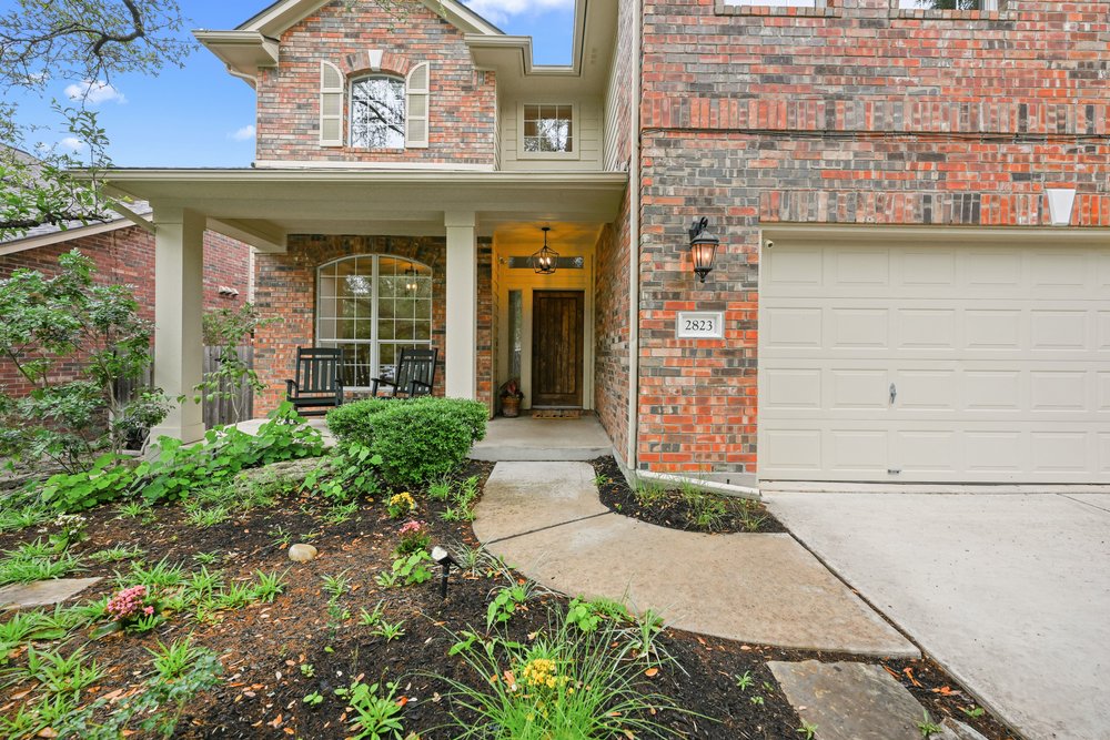 2823 Lantana Ridge Drive Austin, TX 78732 - Photo 2 of 34 a view of a pathway door of the house