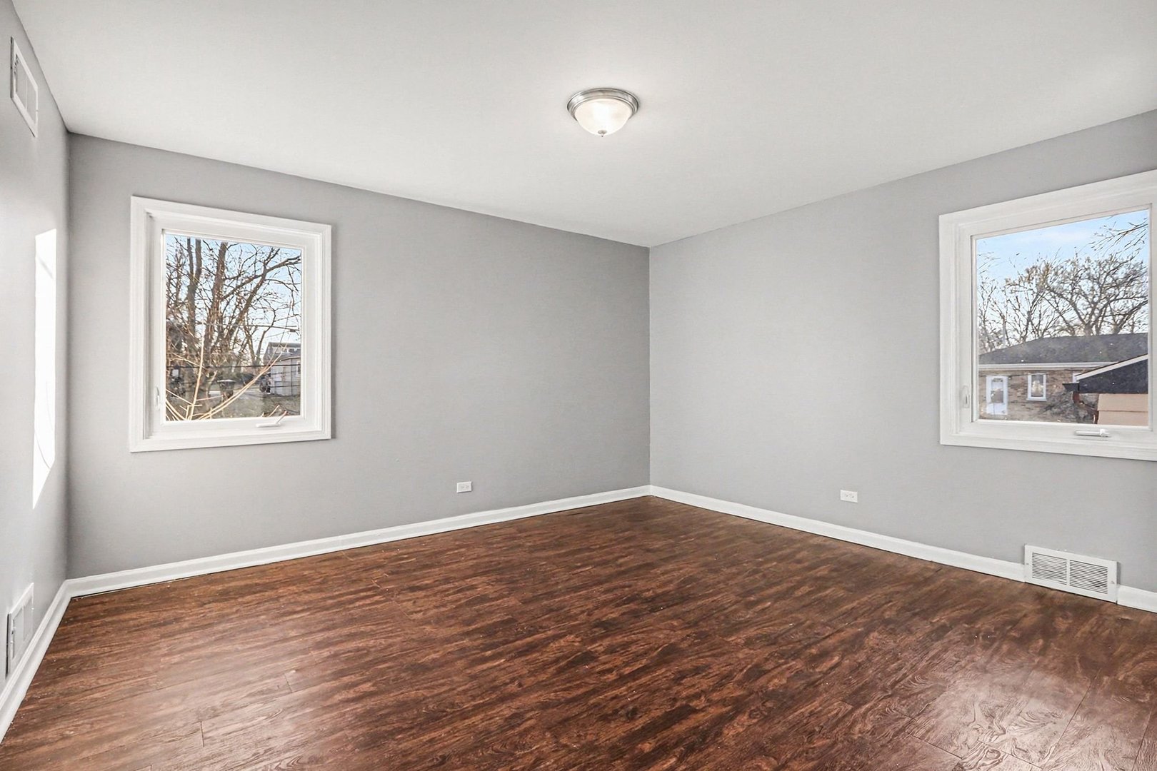 2817 173rd Street Hazel Crest, IL 60429 - Photo 12 of 23 a view of wooden floor and windows in a room
