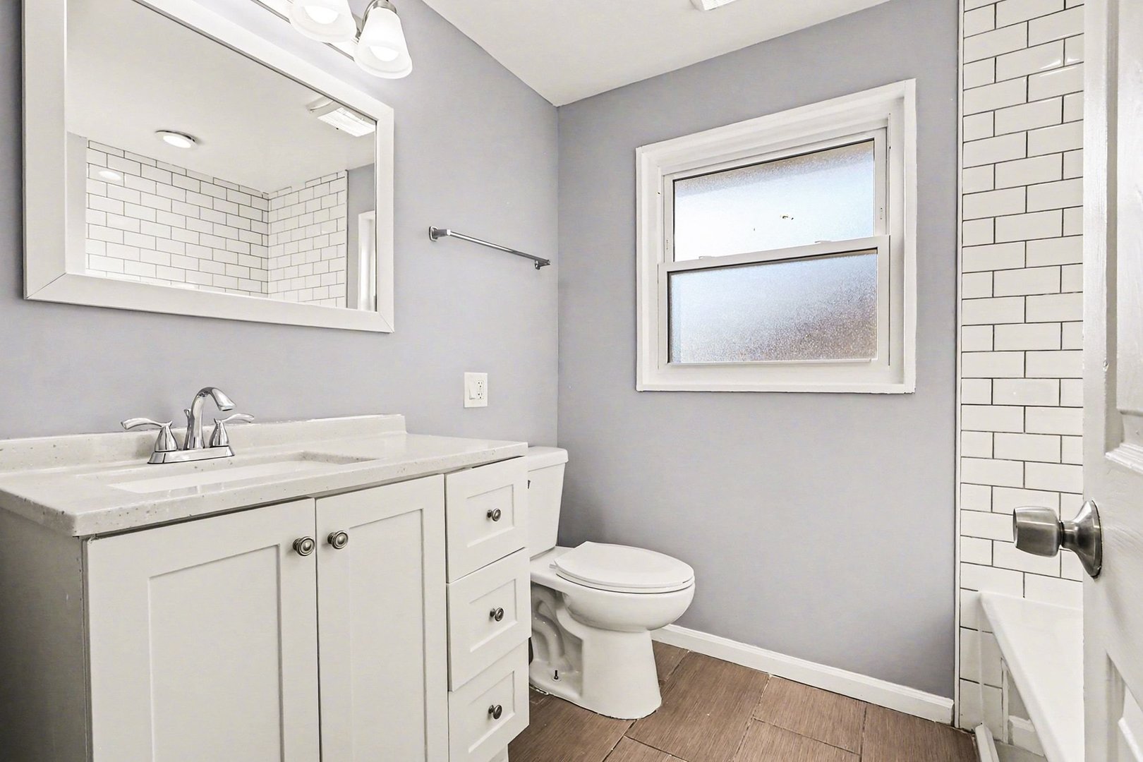 2817 173rd Street Hazel Crest, IL 60429 - Photo 13 of 23 a bathroom with a toilet sink vanity and mirror