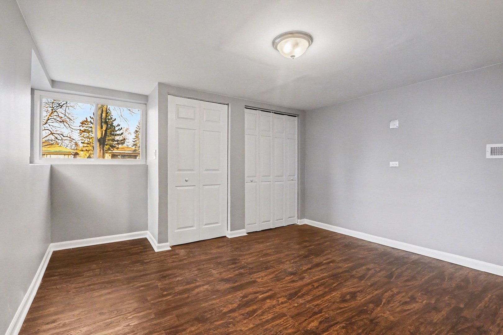 2817 173rd Street Hazel Crest, IL 60429 - Photo 19 of 23 wooden floor in an empty room with a window