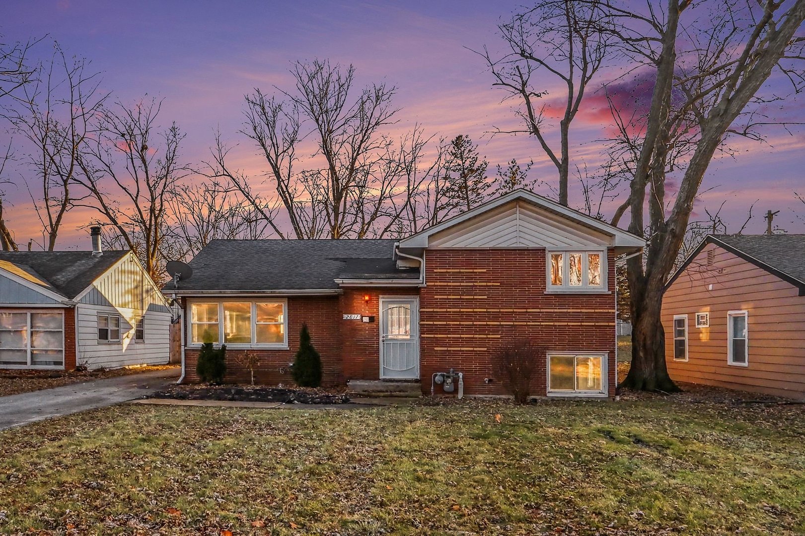 2817 173rd Street Hazel Crest, IL 60429 - Photo 22 of 23 a front view of a house with a yard