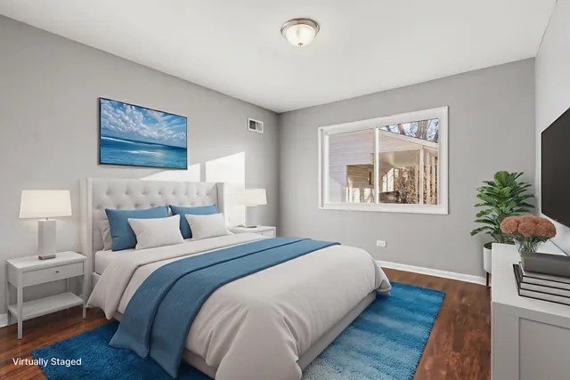 a bedroom with bed and a window