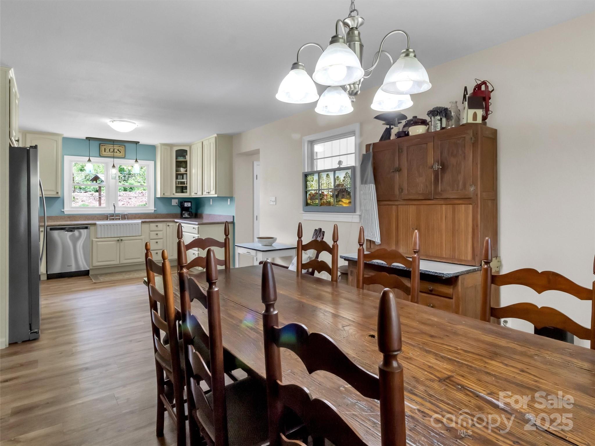 463 Golf Course Road Clyde, NC 28721 - Photo 12 of 41 a view of a dining room with furniture and chandelier