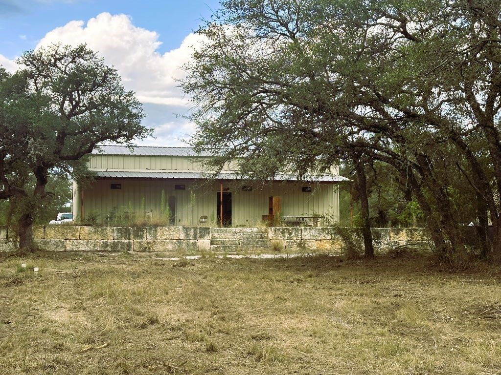 52 Timbers Drive Leakey, TX 78873 - Photo 4 of 28 a front view of a house with large trees