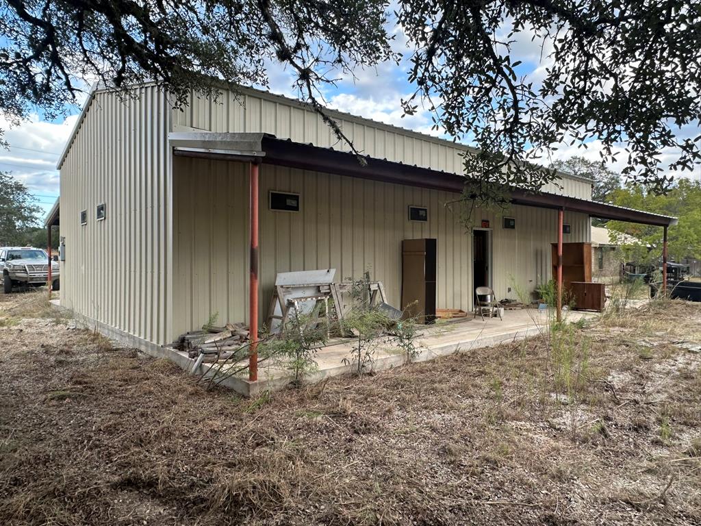 52 Timbers Drive Leakey, TX 78873 - Photo 6 of 28 a backyard of a house with table and chairs