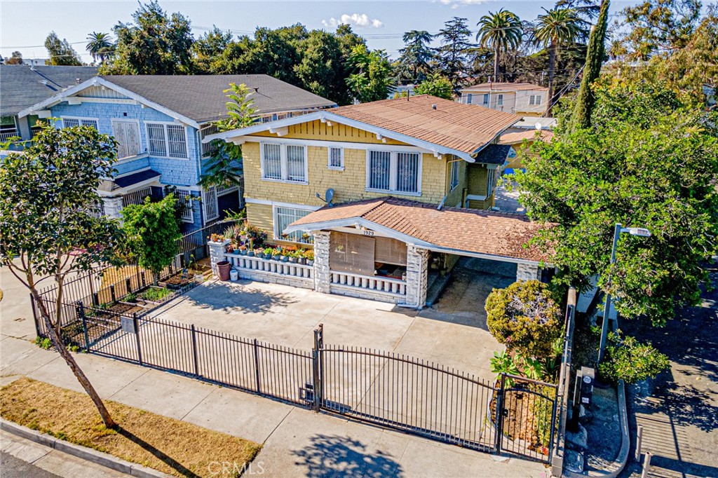 1929 Crenshaw Boulevard Los Angeles, CA 90016 - Photo 2 of 13 a front view of a house with balcony