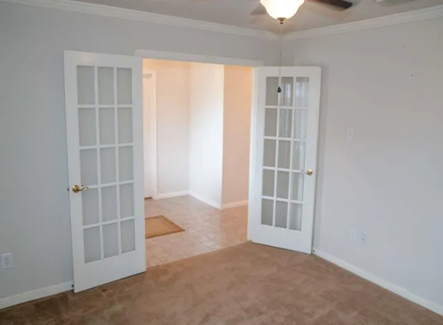 an empty room with a empty space and windows