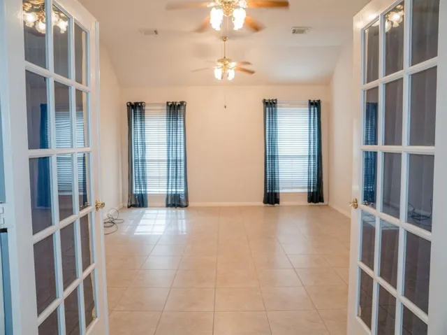 a view of an empty room with a window