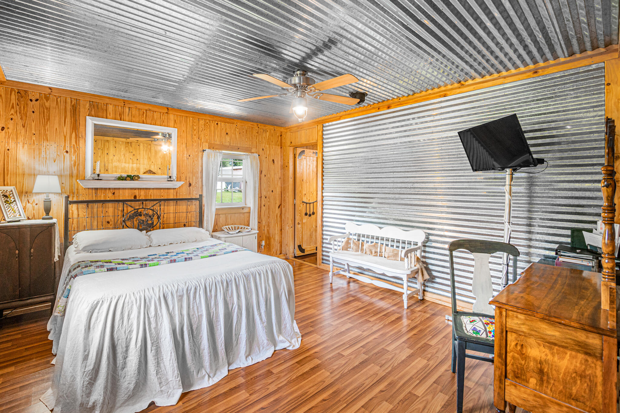 5263 Coy Burgess Loop DeFuniak Springs, FL 32435 - Photo 15 of 57 a bedroom with a bed and wooden floor