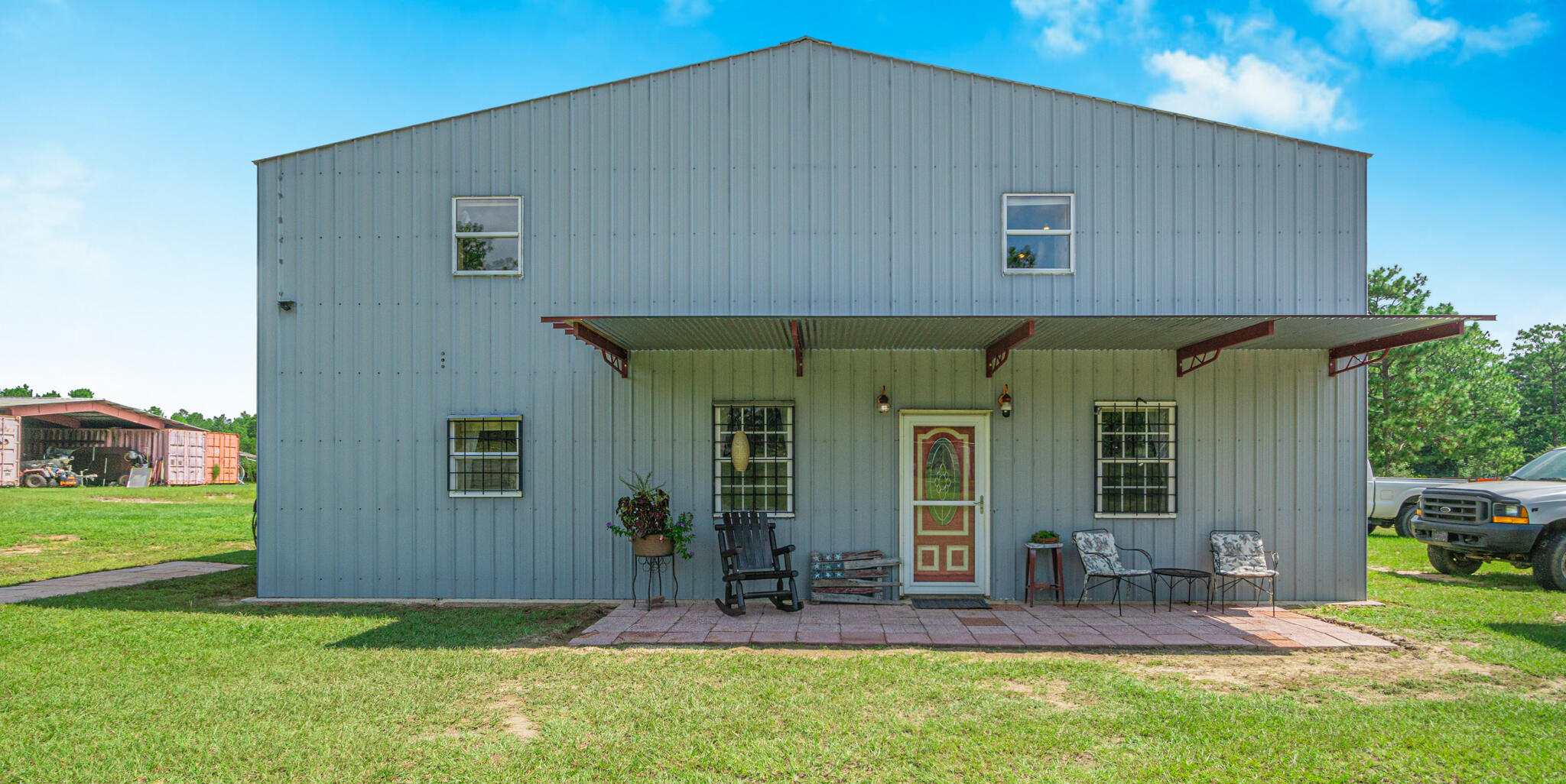 5263 Coy Burgess Loop DeFuniak Springs, FL 32435 - Photo 40 of 57 a backyard of a house with outdoor seating