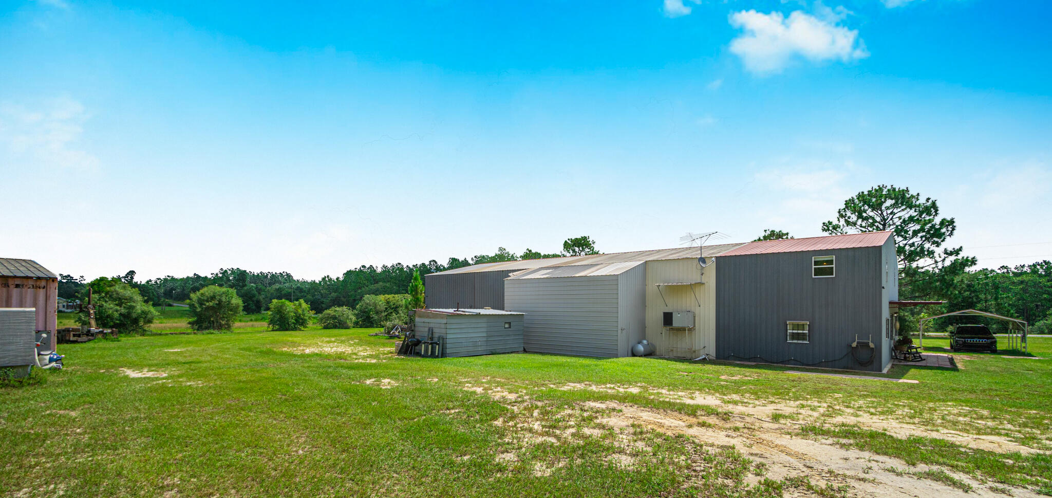 5263 Coy Burgess Loop DeFuniak Springs, FL 32435 - Photo 45 of 57 a backyard of a house with lots of green space and mountain view