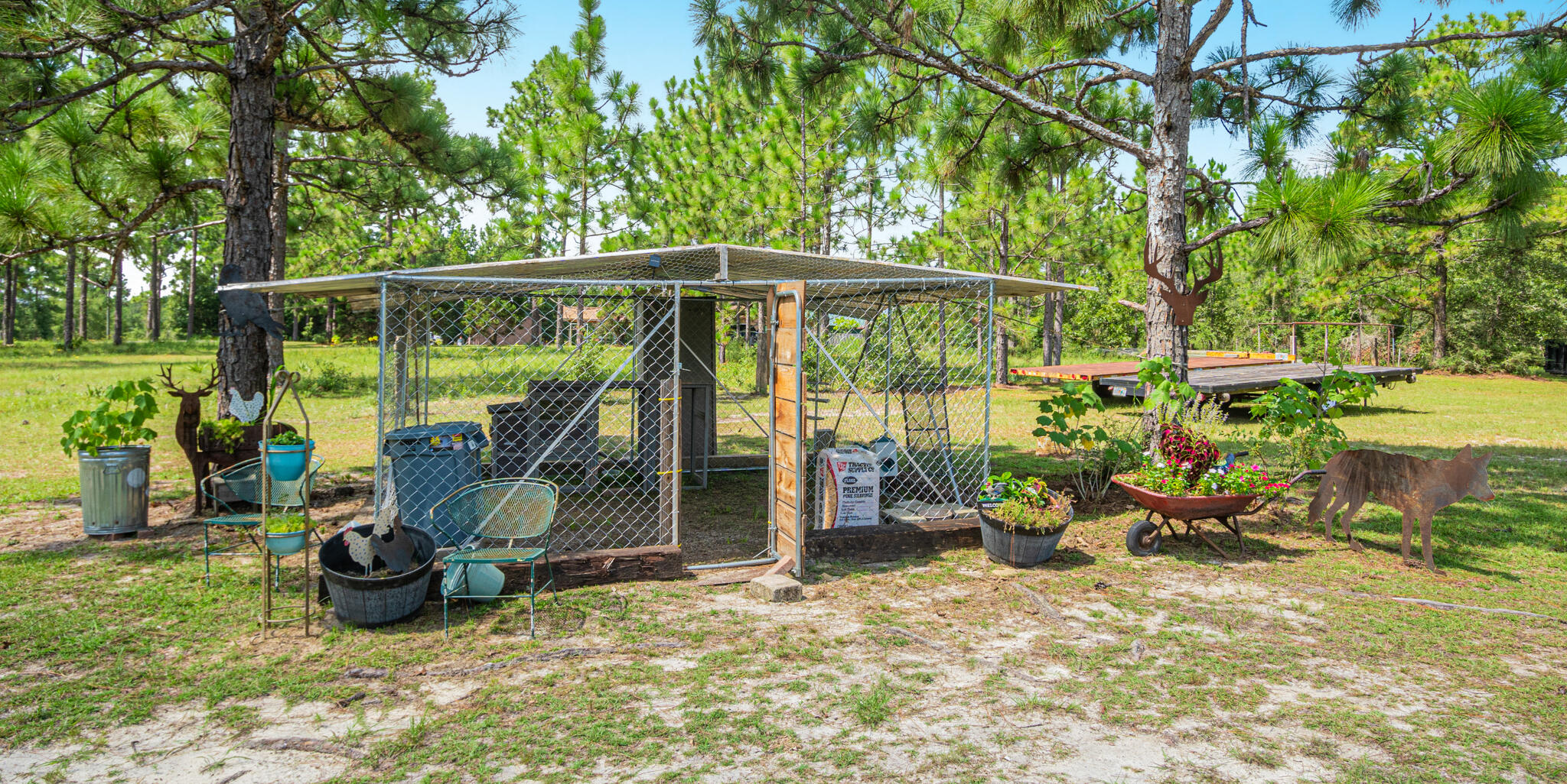 5263 Coy Burgess Loop DeFuniak Springs, FL 32435 - Photo 47 of 57 a view of a patio with a table chairs and a backyard