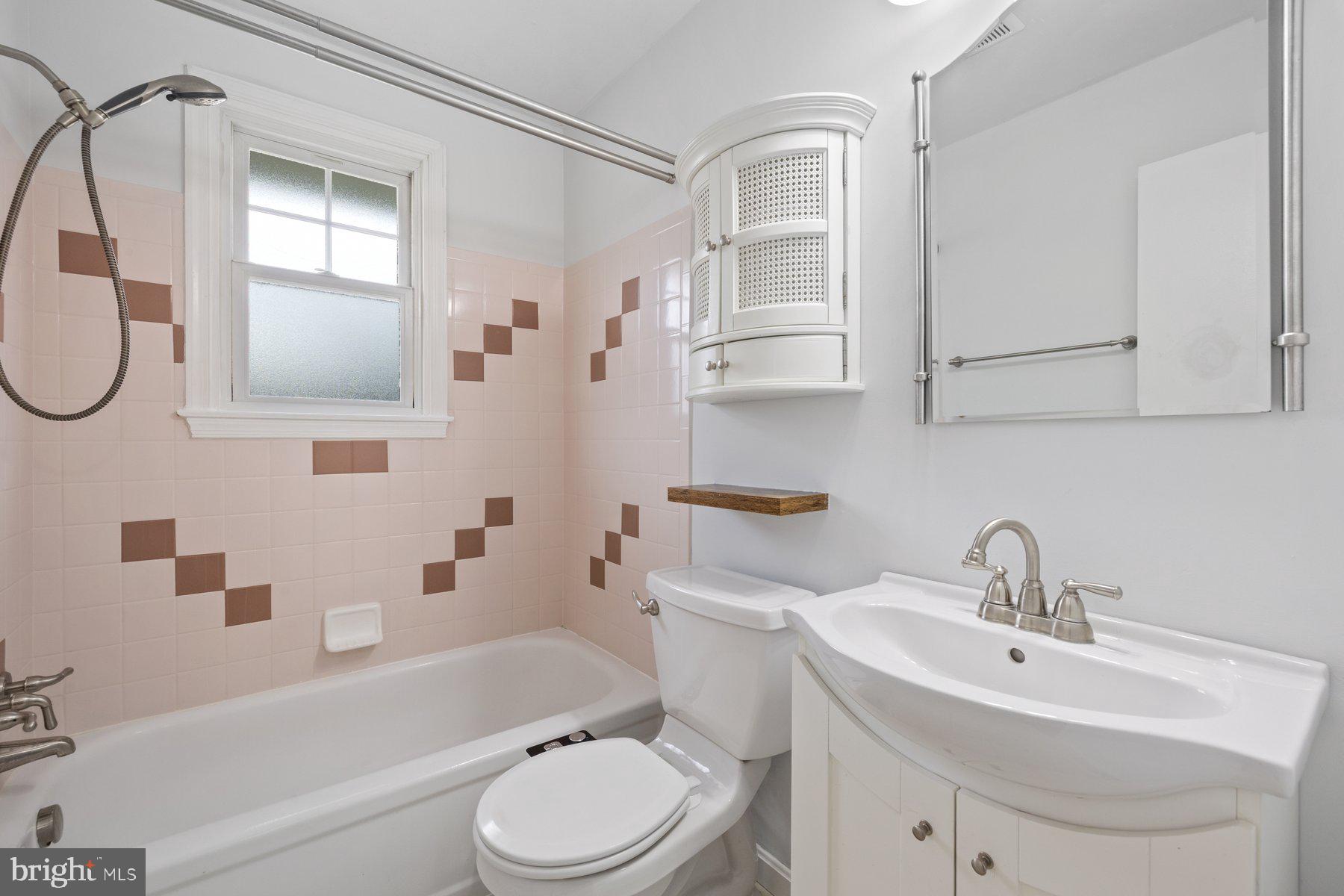 1302 Squire Lane Dunkirk, MD 20754 - Photo 12 of 31 a bathroom with a sink toilet and shower