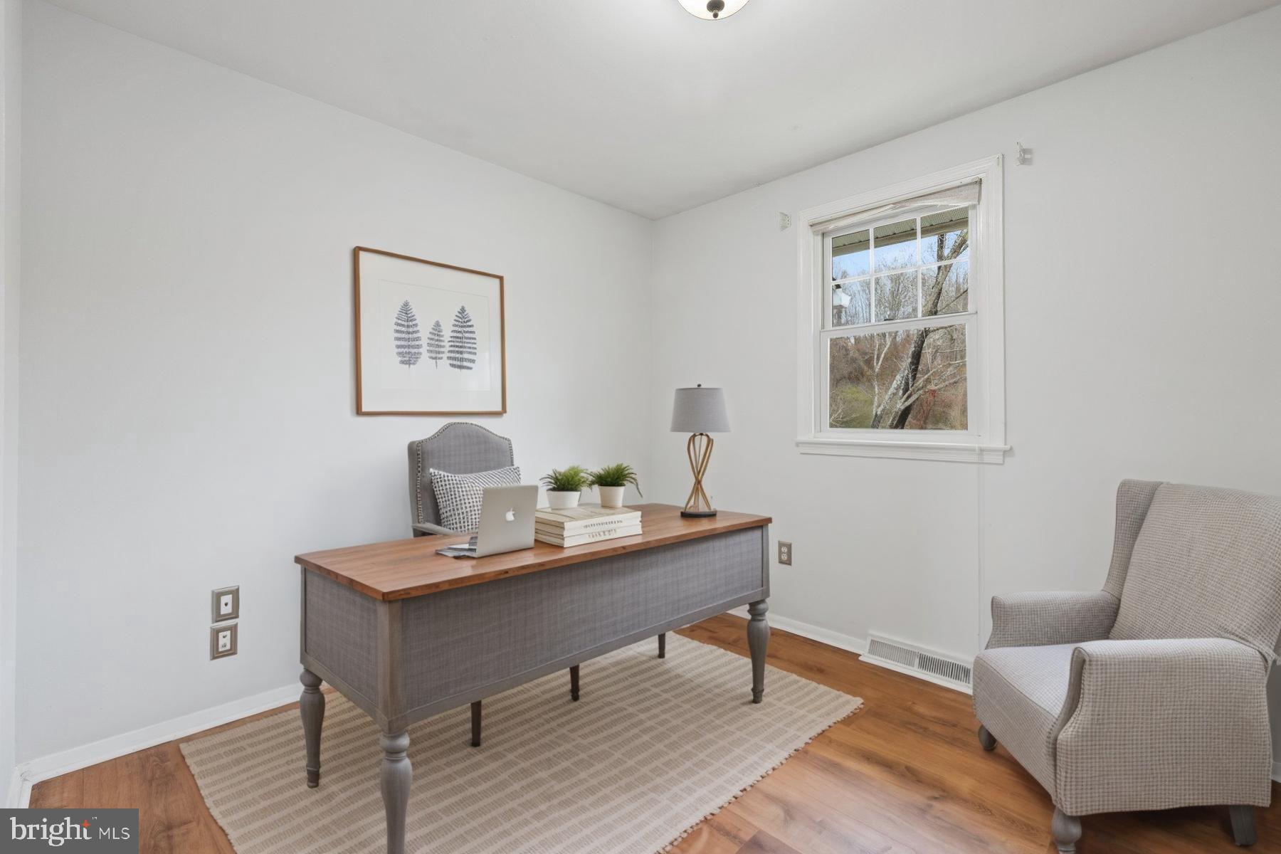 1302 Squire Lane Dunkirk, MD 20754 - Photo 13 of 31 a workspace with furniture and wooden floor