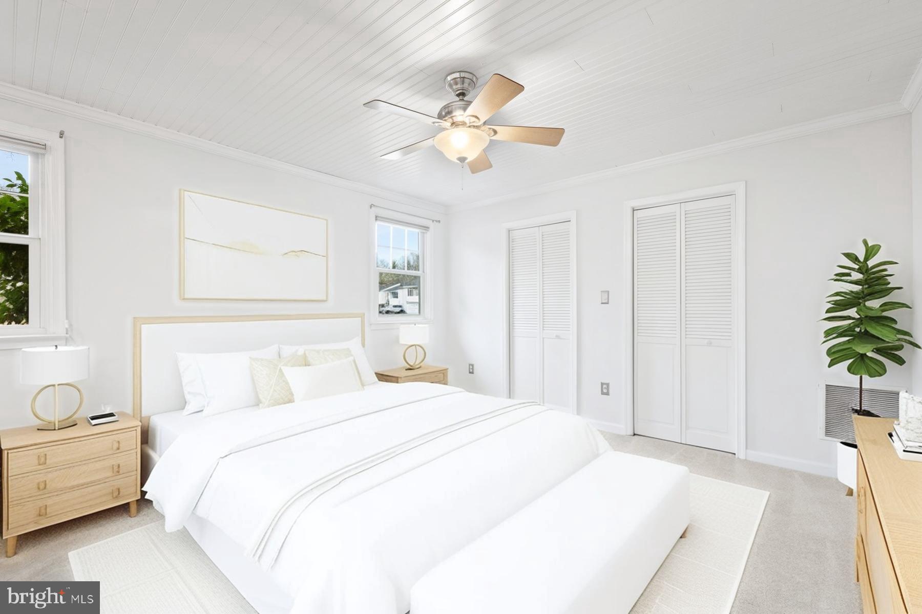 1302 Squire Lane Dunkirk, MD 20754 - Photo 19 of 31 a bedroom with a bed and a chandelier