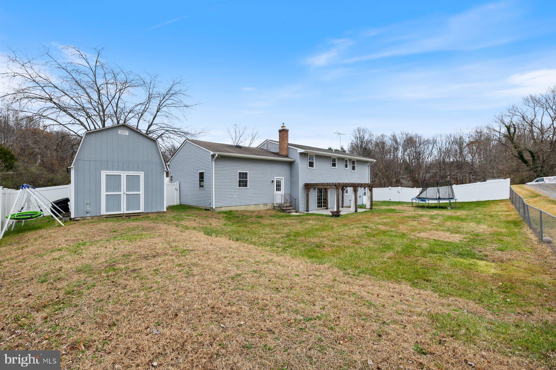 1302 Squire Lane Dunkirk, MD 20754 - Photo 27 of 31 a view of a house with a yard
