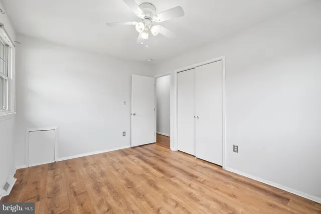 a view of a room with a ceiling fan