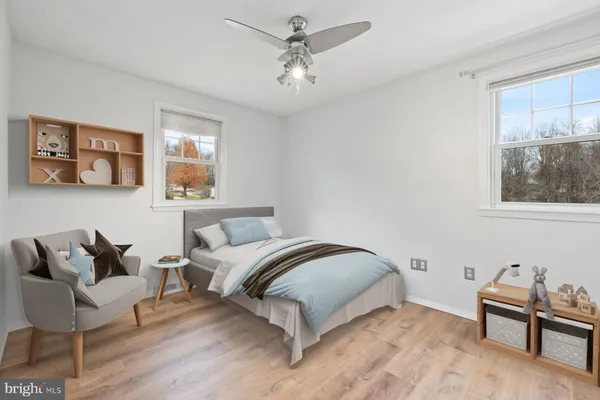 a bedroom with a bed and a couch