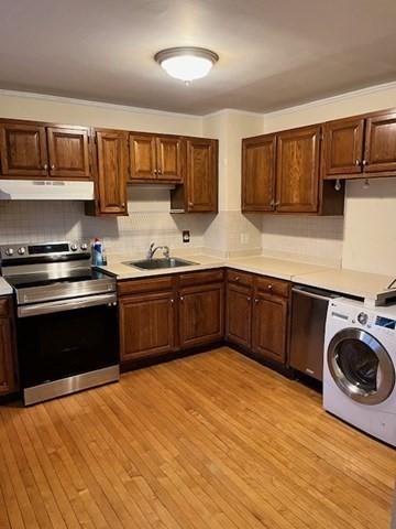 12 Aberdeen Street, Unit 2 Boston, MA 02215 - Photo 3 of 9 a kitchen with stainless steel appliances granite countertop a sink dishwasher stove and oven with wooden floor