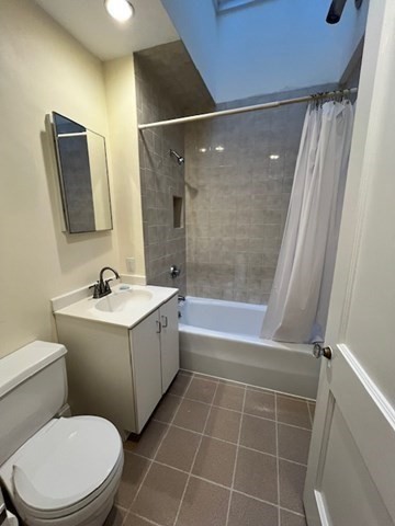 12 Aberdeen Street, Unit 2 Boston, MA 02215 - Photo 5 of 9 a bathroom with a sink mirror vanity and toilet