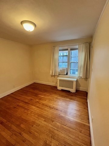 12 Aberdeen Street, Unit 2 Boston, MA 02215 - Photo 8 of 9 a spacious bedroom with a bed and a window