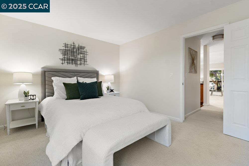 4081 Clayton Road, Unit 218 Concord, CA 94521 - Photo 12 of 26 a bedroom with a bed and a table