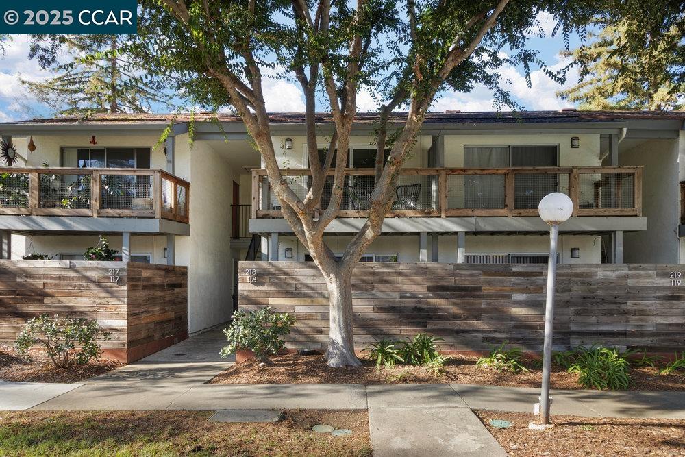4081 Clayton Road, Unit 218 Concord, CA 94521 - Photo 19 of 26 a front view of a house with a yard