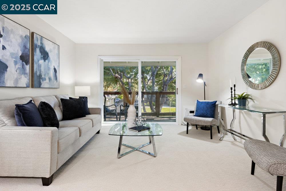 4081 Clayton Road, Unit 218 Concord, CA 94521 - Photo 4 of 26 a living room with furniture and a large window