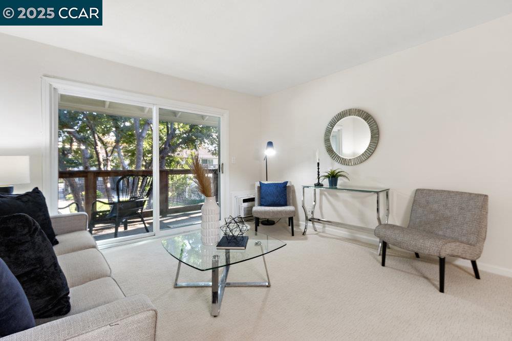 4081 Clayton Road, Unit 218 Concord, CA 94521 - Photo 5 of 26 a living room with furniture and a large window