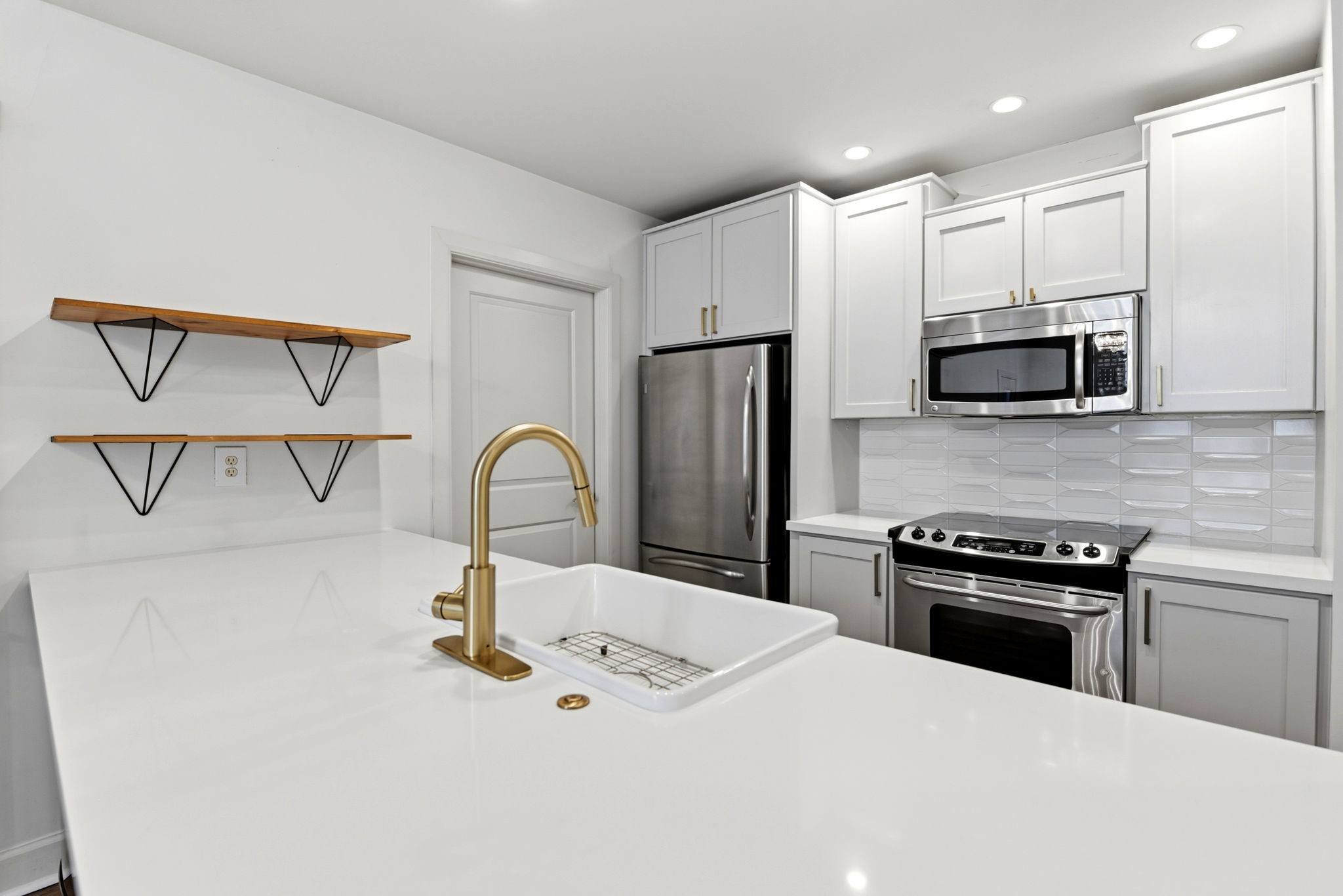 1010 Rosine Street, Unit 43 Houston, TX 77019 - Photo 13 of 48 a kitchen with stainless steel appliances granite countertop a sink and a stove