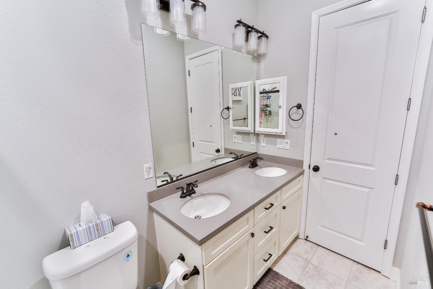 1331 Ridgecrest Court Santa Rosa, CA 95403 - Photo 13 of 19 a bathroom with a sink double vanity and a mirror