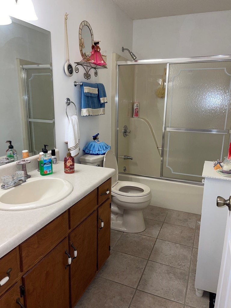 204 Crystal Springs Road Cleveland, TN 37323 - Photo 11 of 22 a bathroom with a sink a toilet and shower